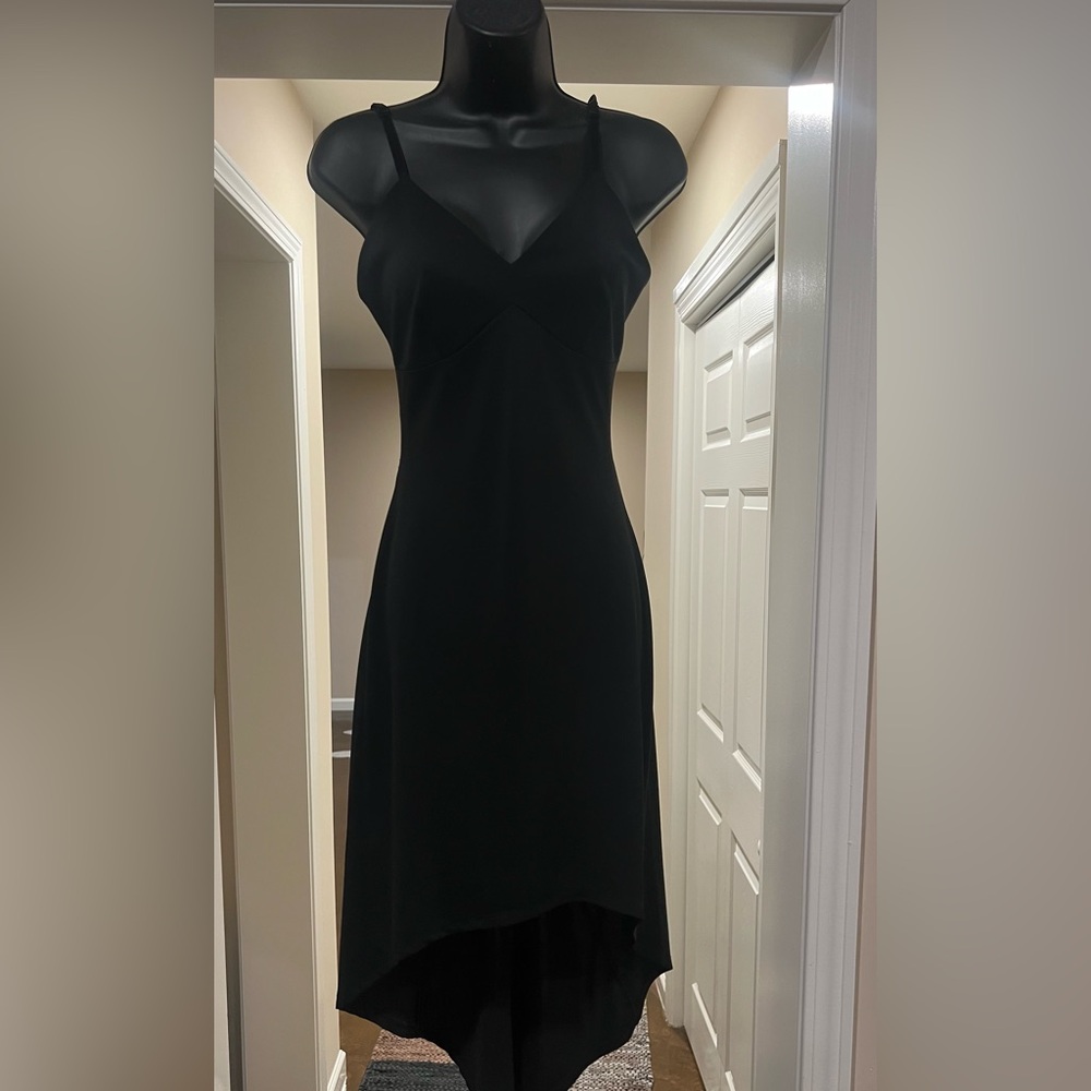 Vintage 90s 2k black dress. Strappy open back.
By FUBU in the late 90s.